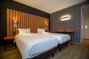 Postel nebo postele na pokoji v ubytování Best Western Côte des Sables Plouescat