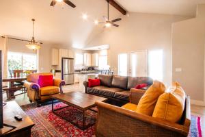 a living room with a couch and a table at Charm on Chestnut in Paso Robles