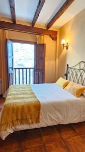 Posteľ alebo postele v izbe v ubytovaní Casa Rural El Campanario