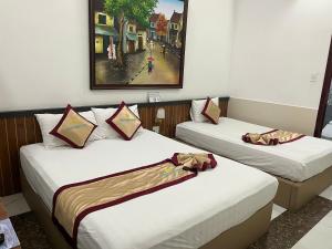 Postel nebo postele na pokoji v ubytování Minh Minh Nam Hotel