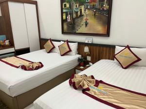 Postel nebo postele na pokoji v ubytování Minh Minh Nam Hotel
