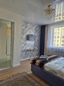 Giường trong phòng chung tại ЖК Аягоз