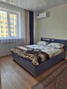 Giường trong phòng chung tại ЖК Аягоз