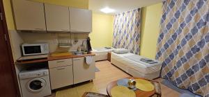 a small room with a kitchen and a living room at Rainbow 2 studio 7 in Sunny Beach