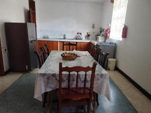 a kitchen with a table with a cat sitting on it at Coastal Villa in Mauritius