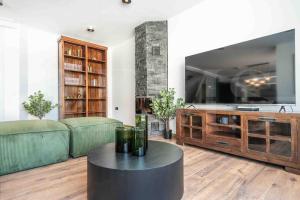 a living room with a couch and a table at Exclusive Villa, private pool, BBQ and beach access REMS in Torremolinos