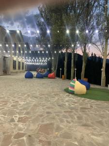 a group of bean bags in a courtyard with lights at AVAGYAN'S Hotel-restaurant in Goris