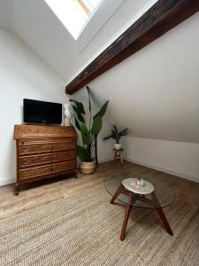 a living room with a tv and a coffee table at House in Jupille-sur-Meuse with terrace and barbecue in Jupille