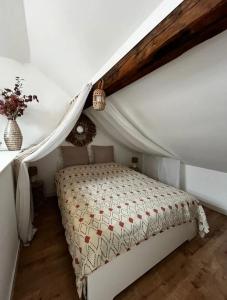a bedroom with a bed in a attic at House in Jupille-sur-Meuse with terrace and barbecue in Jupille +11 photos