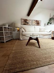a living room with a couch and a coffee table at House in Jupille-sur-Meuse with terrace and barbecue in Jupille