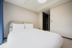 Postel nebo postele na pokoji v ubytování Odays Osiria Residence