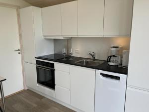 Kuchyň nebo kuchyňský kout v ubytování DCU-Camping Lyngvig Strand