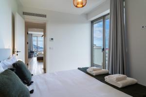 Ένα ή περισσότερα κρεβάτια σε δωμάτιο στο GuestReady - The perfect view in Funchal +45 φωτογραφίες
