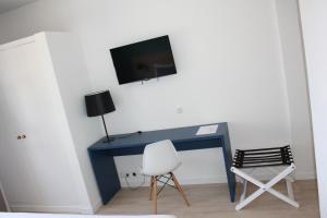 TV a/nebo společenská místnost v ubytování Flag Hotel Santarém