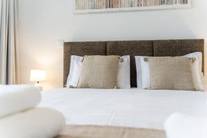 Ένα ή περισσότερα κρεβάτια σε δωμάτιο στο GuestReady - The perfect view in Funchal
