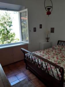 Ένα ή περισσότερα κρεβάτια σε δωμάτιο στο Casa degli Ulivi