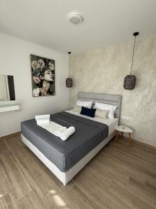 a bedroom with a large bed in a room at Villa Casa Solea in Myrthios +24 photos
