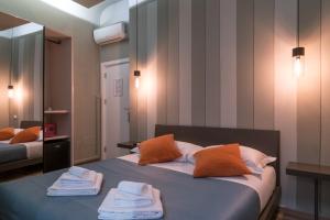 Postel nebo postele na pokoji v ubytování GOGO` Petit Hotel