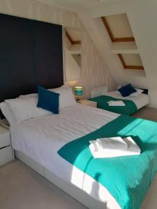 Ένα ή περισσότερα κρεβάτια σε δωμάτιο στο Top floor apartment