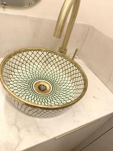 a bathroom sink with a metal sink at Maison de Charme Centre Roquette, 3 chambres in Arles +47 photos
