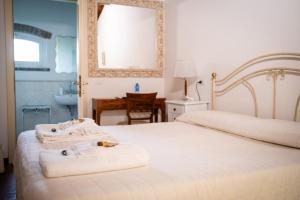 Postel nebo postele na pokoji v ubytování Agriturismo Corte Capiluppia