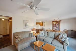 a living room with two couches and a ceiling fan at Quick Silver 9D - Comfy Townhome for All Seasons in North Creek