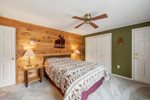 a bedroom with a bed with a horse on the wall at Arena in North Creek