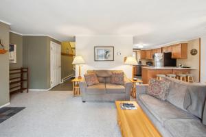 a living room with a couch and a table at Arena in North Creek