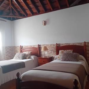 A bed or beds in a room at CASA DE LA CRUZ