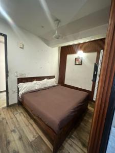 Postel nebo postele na pokoji v ubytování Hotel Lagoon Inn - Malviya Nagar