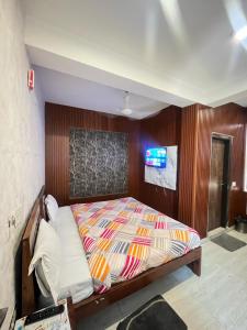 Postel nebo postele na pokoji v ubytování Hotel Lagoon Inn - Malviya Nagar