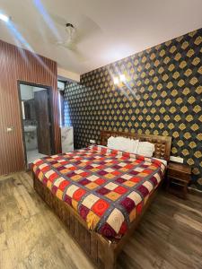 Postel nebo postele na pokoji v ubytování Hotel Lagoon Inn - Malviya Nagar