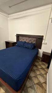 Postel nebo postele na pokoji v ubytování Jacob Residency
