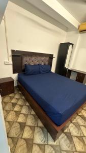 Postel nebo postele na pokoji v ubytování Jacob Residency