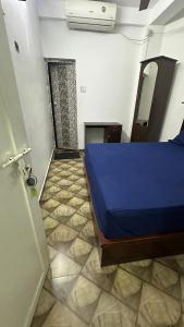 Postel nebo postele na pokoji v ubytování Jacob Residency