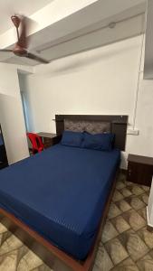 Postel nebo postele na pokoji v ubytování Jacob Residency