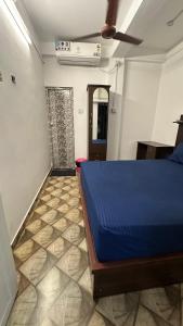 Postel nebo postele na pokoji v ubytování Jacob Residency