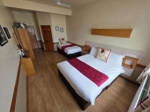 Cama ou camas em um quarto em Villager Hotel, Ingoldmells