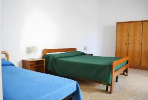 Voodi või voodid majutusasutuse Pt62 Casa a T dell Orso x 6 ospiti toas