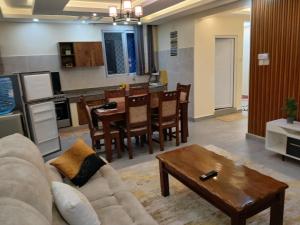 a living room with a couch and a table at Nyali best pavil in Mombasa