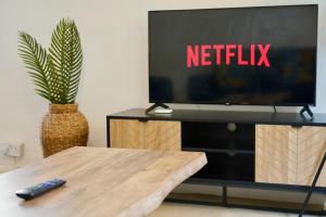 a tv sitting on top of a table with a remote control at Rosehill Walk Peaceful Ground Floor Home in Central Tunbridge Wells in Royal Tunbridge Wells
