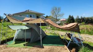 a tent is set up in front of a house at Camping im Igluzelt im Privatgarten mit Komfort Schlüchtern Main-Kinzig in Schlüchtern +46 photos