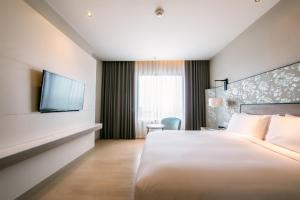 Postel nebo postele na pokoji v ubytování Holiday Inn & Suites Rayong City Centre by IHG