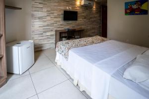 Postel nebo postele na pokoji v ubytování Bessa Beach Hotel