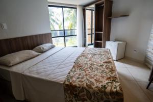 Postel nebo postele na pokoji v ubytování Bessa Beach Hotel