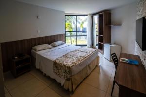 Postel nebo postele na pokoji v ubytování Bessa Beach Hotel + 37 fotografií