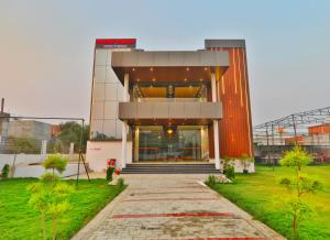 a building with a staircase in front of it at Divine Grace in Bāra Banki