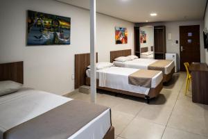 Postel nebo postele na pokoji v ubytování Bessa Beach Hotel