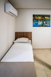 Postel nebo postele na pokoji v ubytování Bessa Beach Hotel