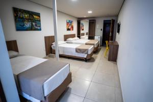 Postel nebo postele na pokoji v ubytování Bessa Beach Hotel